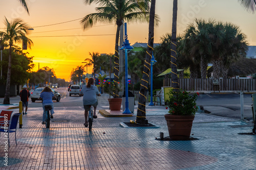 Fotografie Fort Myers Beach, Florida, United States - November 5, 2018: Public Boulevard near a beach during a vibrant sunny sunrise
