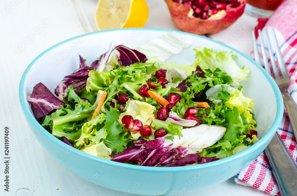 Fresh green salad with pomegranate, vegetarian menu Fresh green salad with pomegranate, vegetarian menu