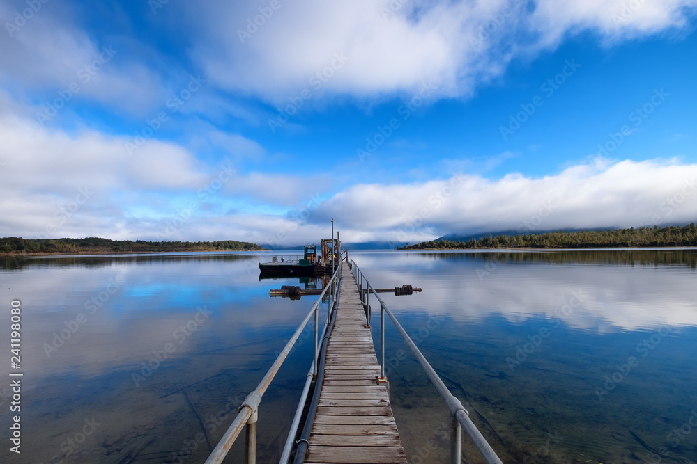 Scenic peaceful background of clear blue lake water and sky Scenic peaceful background of clear blue lake water and sky