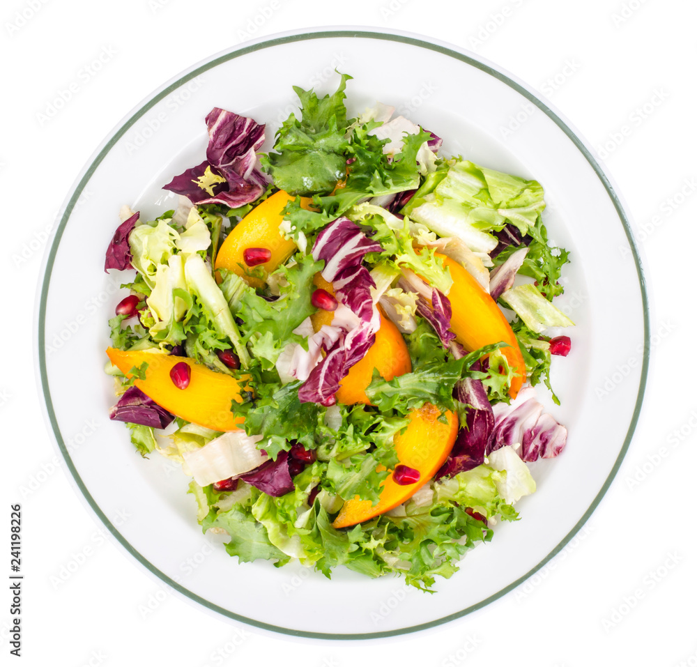 Salad with green leaves and persimmon Salad with green leaves and persimmon