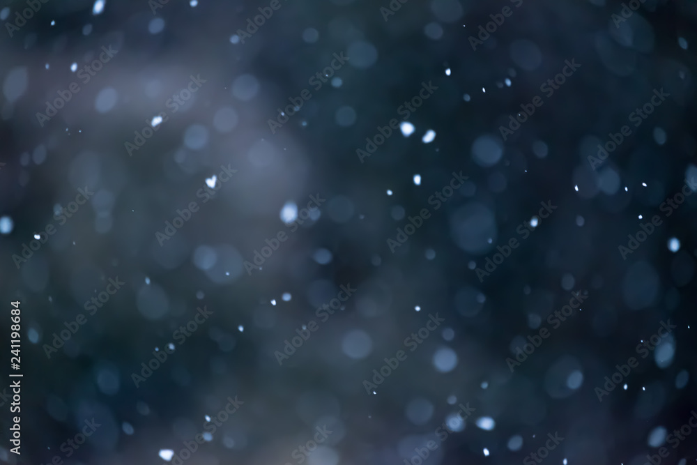 Obraz premium A very soft defocused background of falling snow taken in New Zealand. This is suitable for use in christmas background. One can add text, quote and decorate using this background.