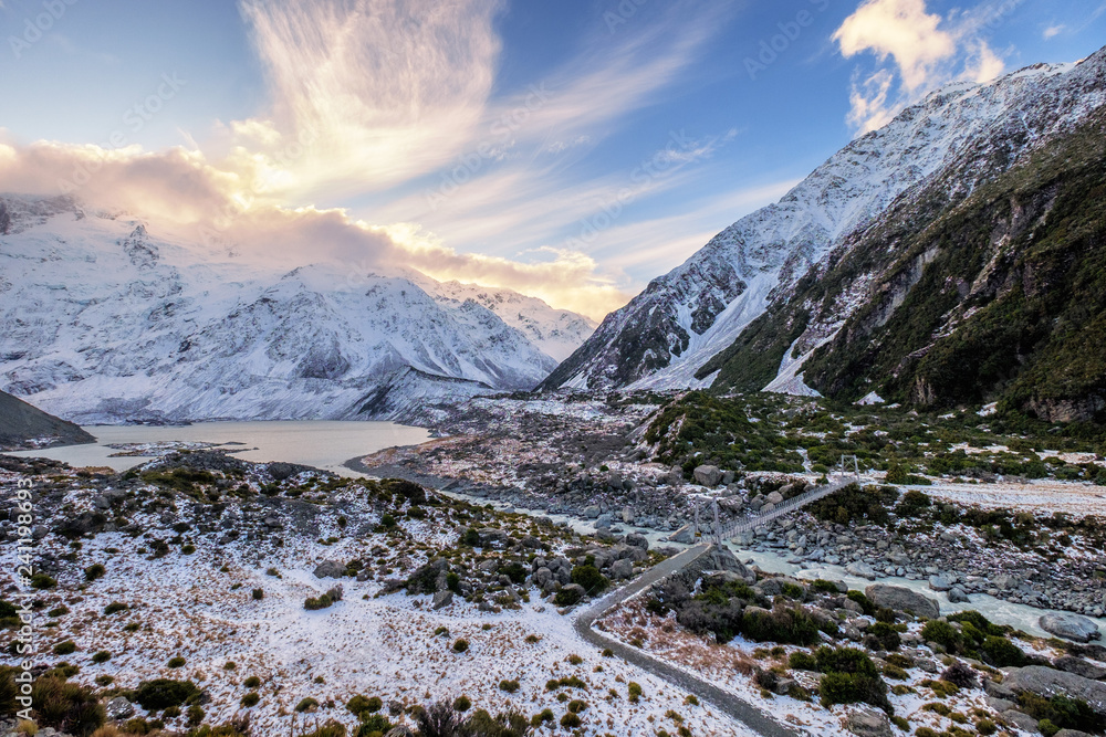 Bridge over Hooker River in Aoraki national park New Zealand. There are snow mountain ranges, glacier, valley and rivers in this area. This is a famous and popular tourist attraction in the world.