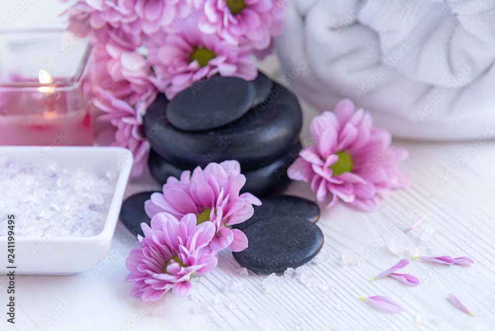 Spa treatment and product for femalespa with pink flower and rock stone, copy space, select focus, Thailand. Healthy Concept Spa treatment and product for femalespa with pink flower and rock stone, copy space, select focus, Thailand. Healthy Concept