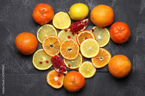Whole and sliced citrus fruits