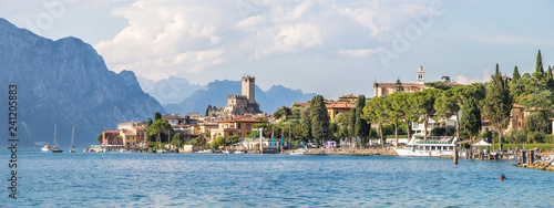 Idyllic coast in Italy: Blue water and a cute village at lago di garda, Malcesine