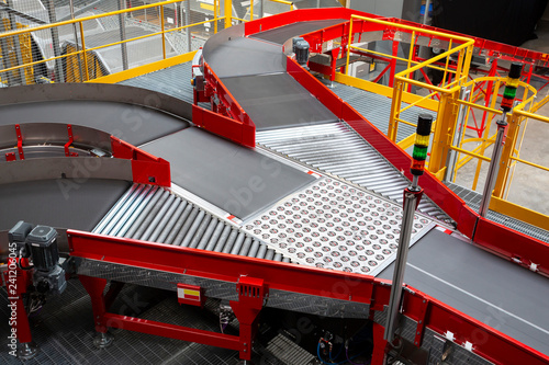 Conveyor sorting belt at distribution warehouse photo