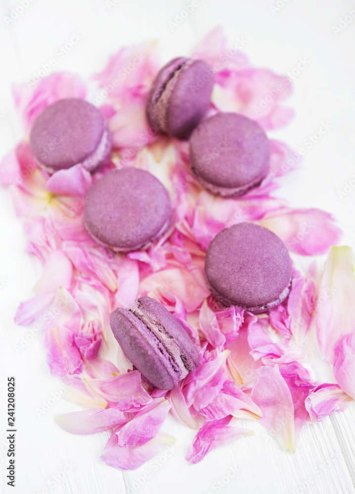 Pink peony petals with macarons Pink peony petals with macarons