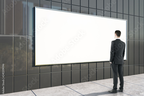 Businessman looking at billboard