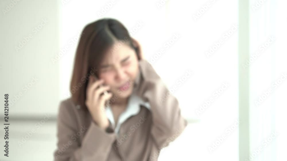 4k Unhappy young working woman walk and talk by smartphone in office 4k Unhappy young working woman walk and talk by smartphone in office
