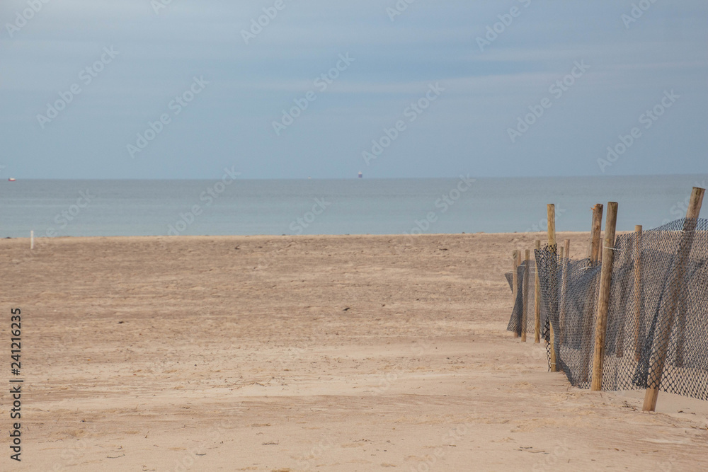 nets with wooden posts on the beach nets with wooden posts on the beach
