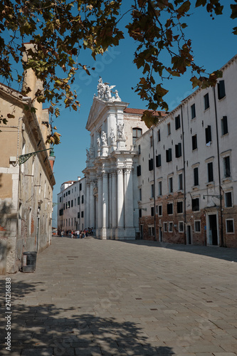 Fototapeta Naklejka Na Ścianę i Meble -  Venice, Italy, September 16, 2018 - Tourists in front of the entrance to the Gesuiti Church in Venice