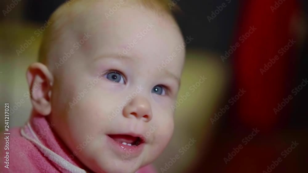 Adorable indoor portrait of cute little girl in a pink jacket. Adorable indoor portrait of cute little girl in a pink jacket.