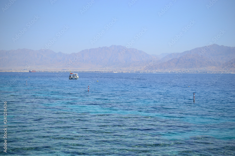 Red Sea turquoise water beach and mountains in Eilat, Israel