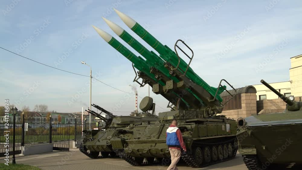 Man takes foto on the smartphone self-propelled launch system of the anti-aircraft missile system Man takes foto on the smartphone self-propelled launch system of the anti-aircraft missile system
