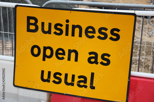 Business open as usual sign