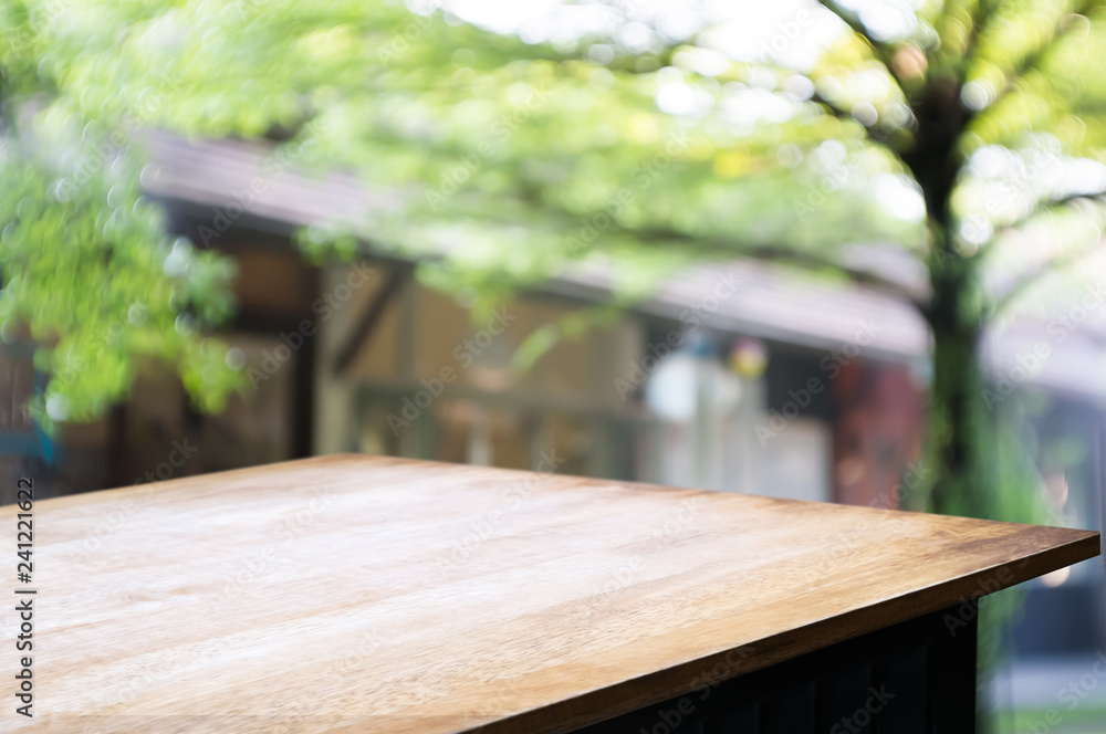 empty wooden table with blur restaurant background