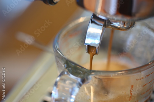 How to making coffee with hot coffee maker machine, selective focus and free space for text, Industrial food and drink concept.