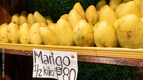 Mango in a wooden shelf, local food market, bohol island, cebu, Asia