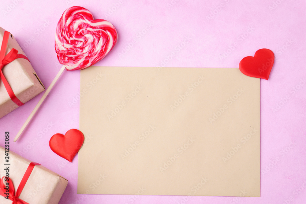 valentine's day greeting card, envelope with handcrafted heart shaped decoration and sweet lollipop. love letter, surprise, celebration concept