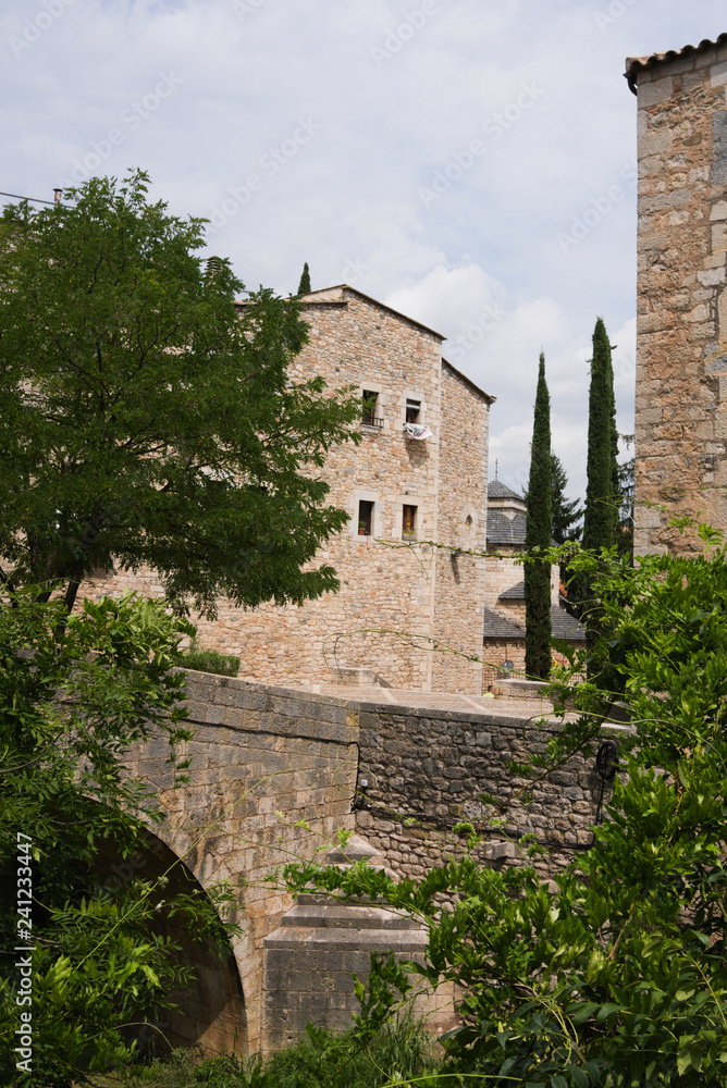 Beautiful view of the medieval fortress of Girona from the side of the park through the eyes of a tourist.