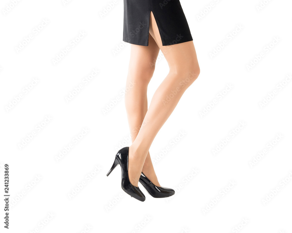 Beautiful slim female legs in classic black shoes and skin color tights, isolated on white, side view Beautiful slim female legs in classic black shoes and skin color tights, isolated on white, side view