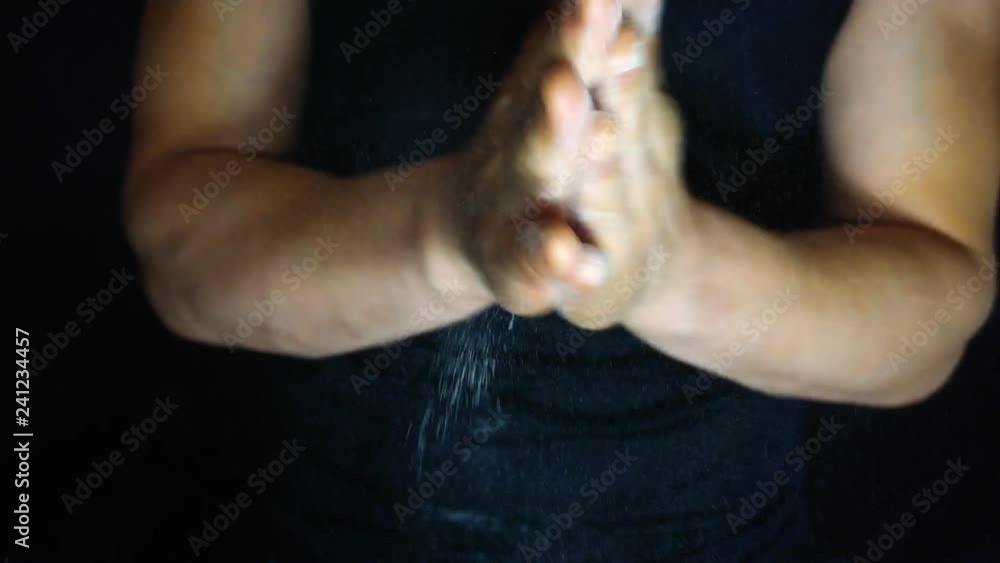 Athlete clapping hands with talc. 1920X1080 Full Hd. Athlete clapping hands with talc. 1920X1080 Full Hd.