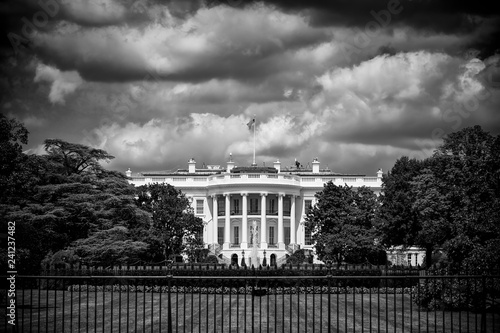 Murais de parede Dark and foreboding monochrome view of the White House with storm clouds brewing