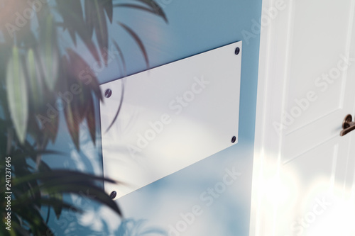 Fotografia Close up of glass nameplate on light blue wall. 3d rendering.