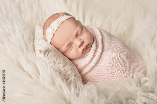 newborn girl on a white background