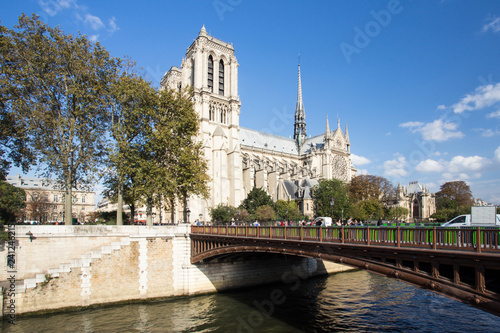 View of Notre Dame Cathedral in Paris France along Seine River 