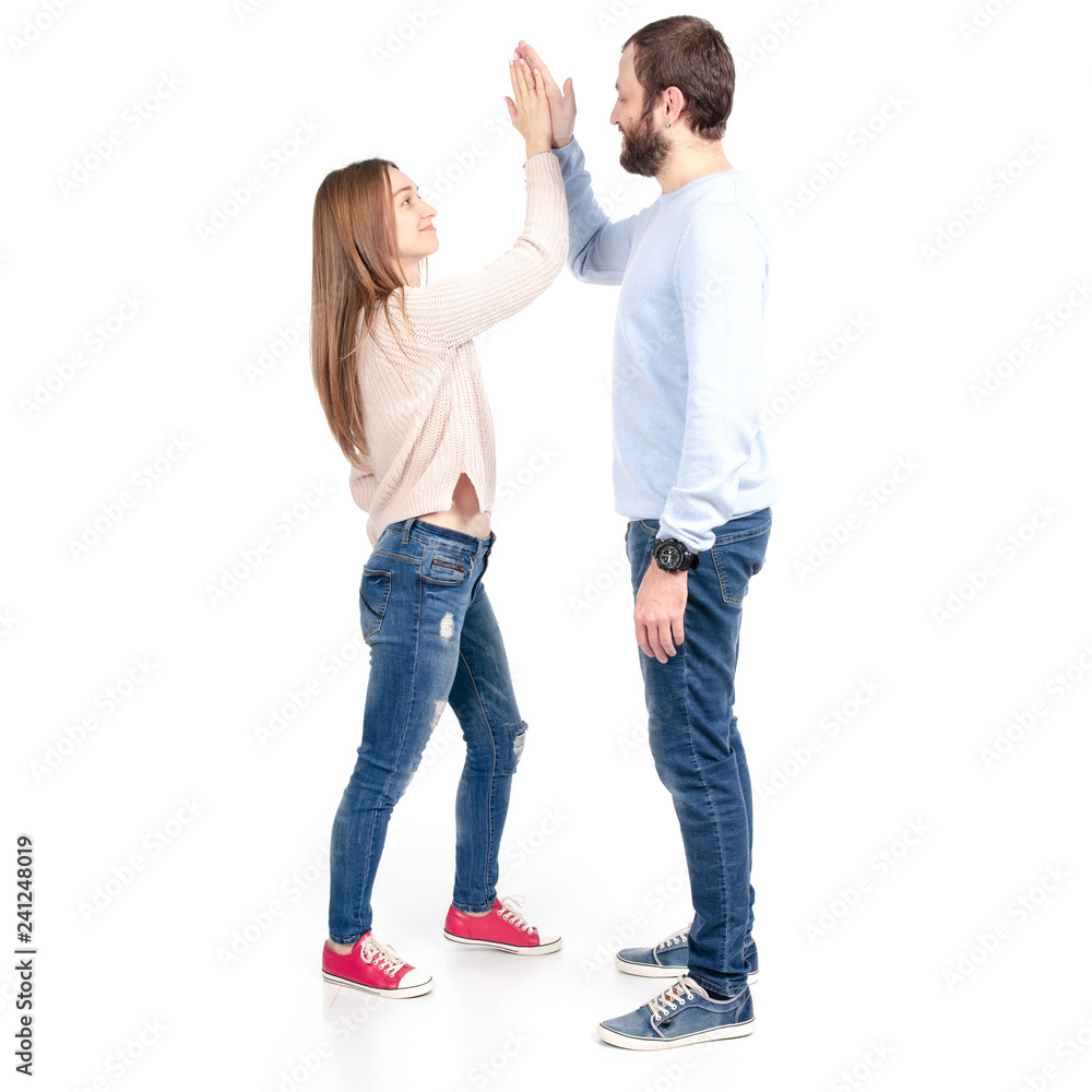 Beautiful woman gives five to man on white background isolation Beautiful woman gives five to man on white background isolation