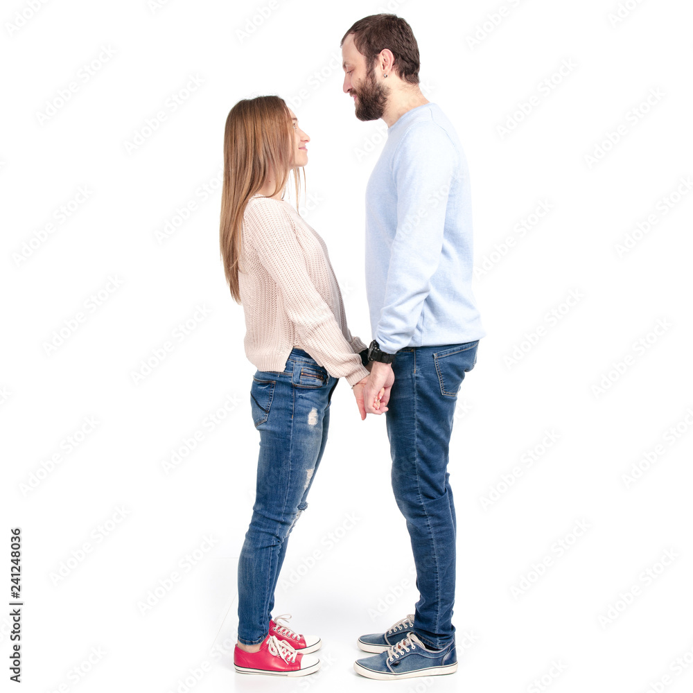 Beautiful woman and man hold hands against on white background isolation