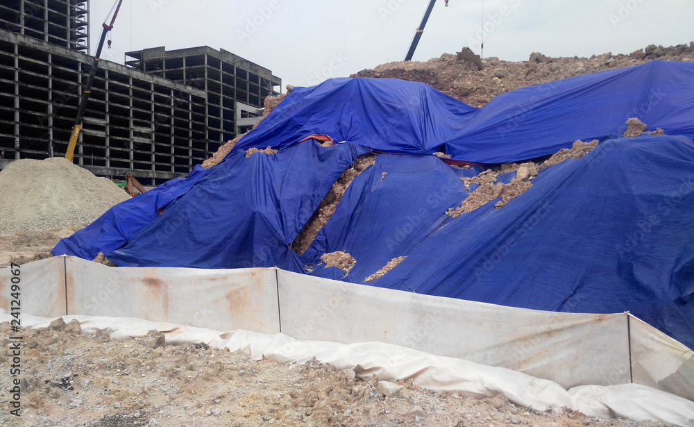 Temporary slope protection using huge plastic sheet at the construction