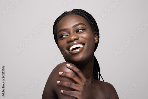 Pretty young afro american woman skincare face enjoying treatment isolated on white background