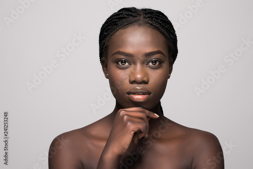 Healthy skin african woman beautiful face close up isolated over gray background