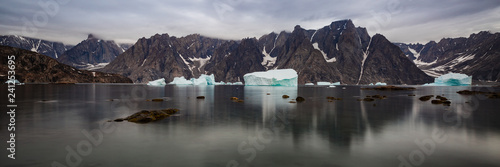arctic landscape with floating iceberg in  the  fjords of East Greenland in summer photo