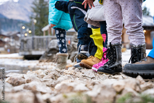 Chidren play near the frozen lake