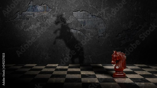 Chess Knight Delusions of Grandeur 4K Loop features a knight chess piece on a board with a concrete wall in the back with the animated shadow of a real horse rearing up on it’s hind legs.