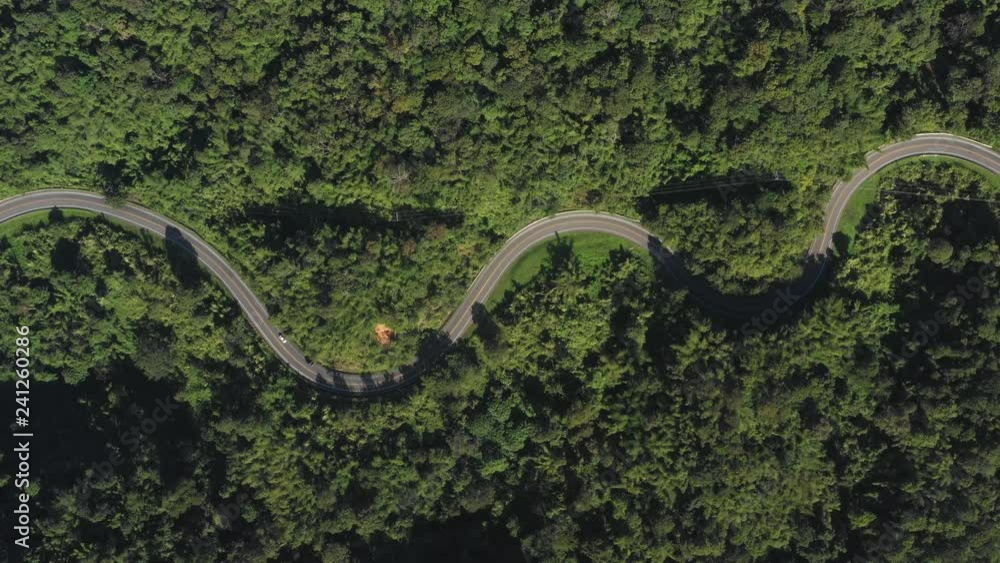 Aerial scene of fly over the road on mountain in day time Aerial scene of fly over the road on mountain in day time