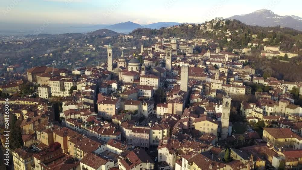 Bergamo, Italy. Drone aerial view of the old town. Landscape at the city center and its historical buildings during winter time Bergamo, Italy. Drone aerial view of the old town. Landscape at the city center and its historical buildings during winter time