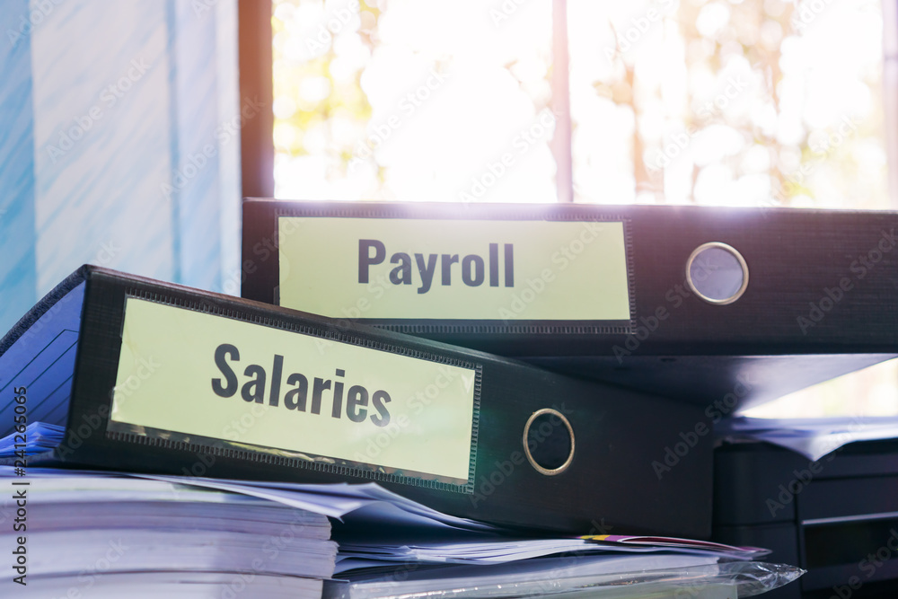 Foto de Payroll and salaries folders stack with label on black binder ...