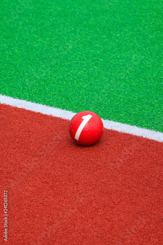 Chinese gate ball on the green plastic pitch