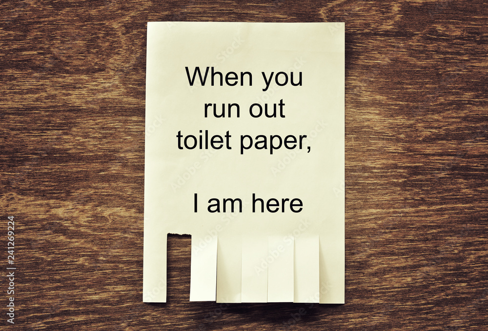 Obraz premium paper notice for tear on wood wall can help when running out of toilet paper