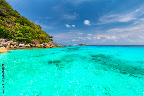 Similan Islands Beautiful tropical sandy beach and lush green foliage on a tropical island ,thailand © rbk365