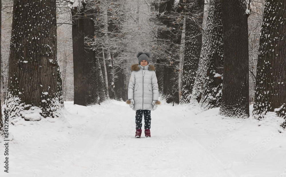 cute child girl in winter in the forest cute child girl in winter in the forest