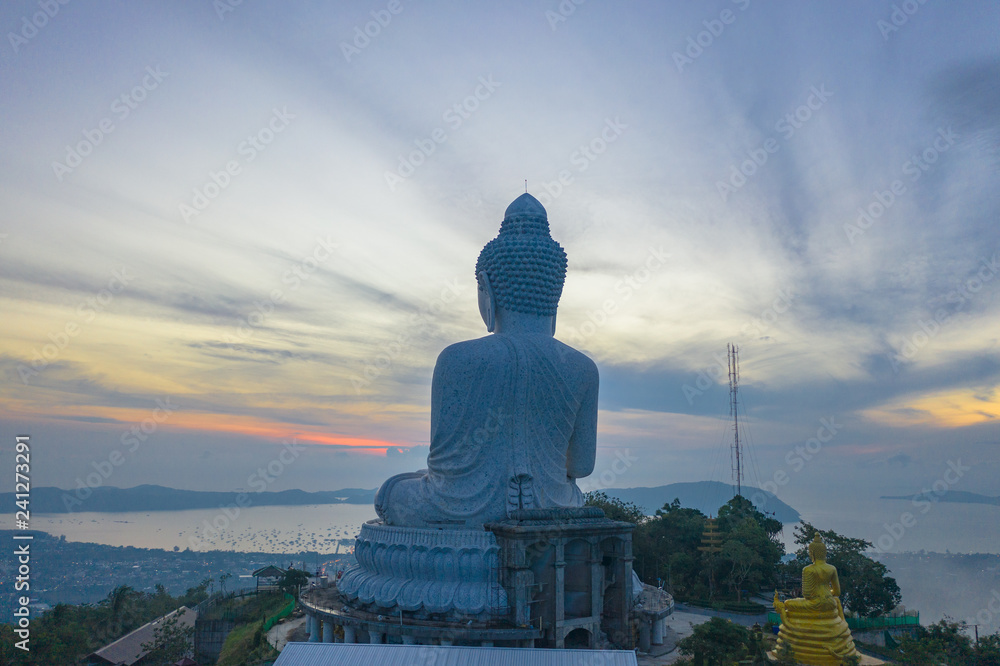 Fototapeta premium aerial photography scenery blue sky and blue ocean behind Phuket white big Buddha. Phuket white big Buddha is the .famous landmark in Phuket island a lot of tourists visiting this landmark every day