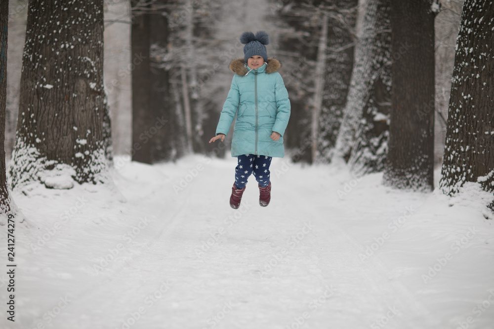 cute child girl in winter in the forest cute child girl in winter in the forest