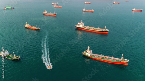Aerial view Oil ship tanker park in the sea wait for unload oil to refinery.
