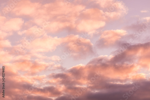 The vivid sky or heaven background of blue, red, crimson and purple clouds of evening sunset or morning daybreak
