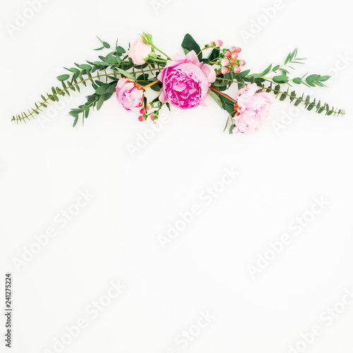 Floral frame of pink peonies and roses flowers and eucalyptus on white background. Flat lay  top view